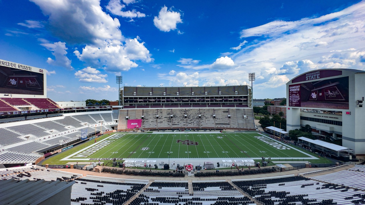 The field and grandstands at Davis Wade Stadium beneath a blue Mississippi sky