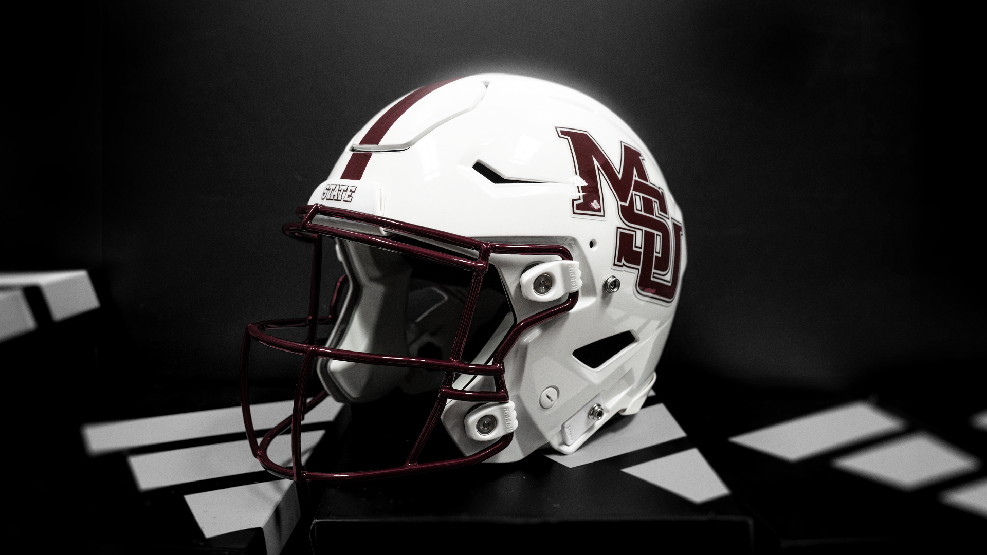 Mississippi State's white interlocking MSU helmet honoring the 2000 Snow Bowl team