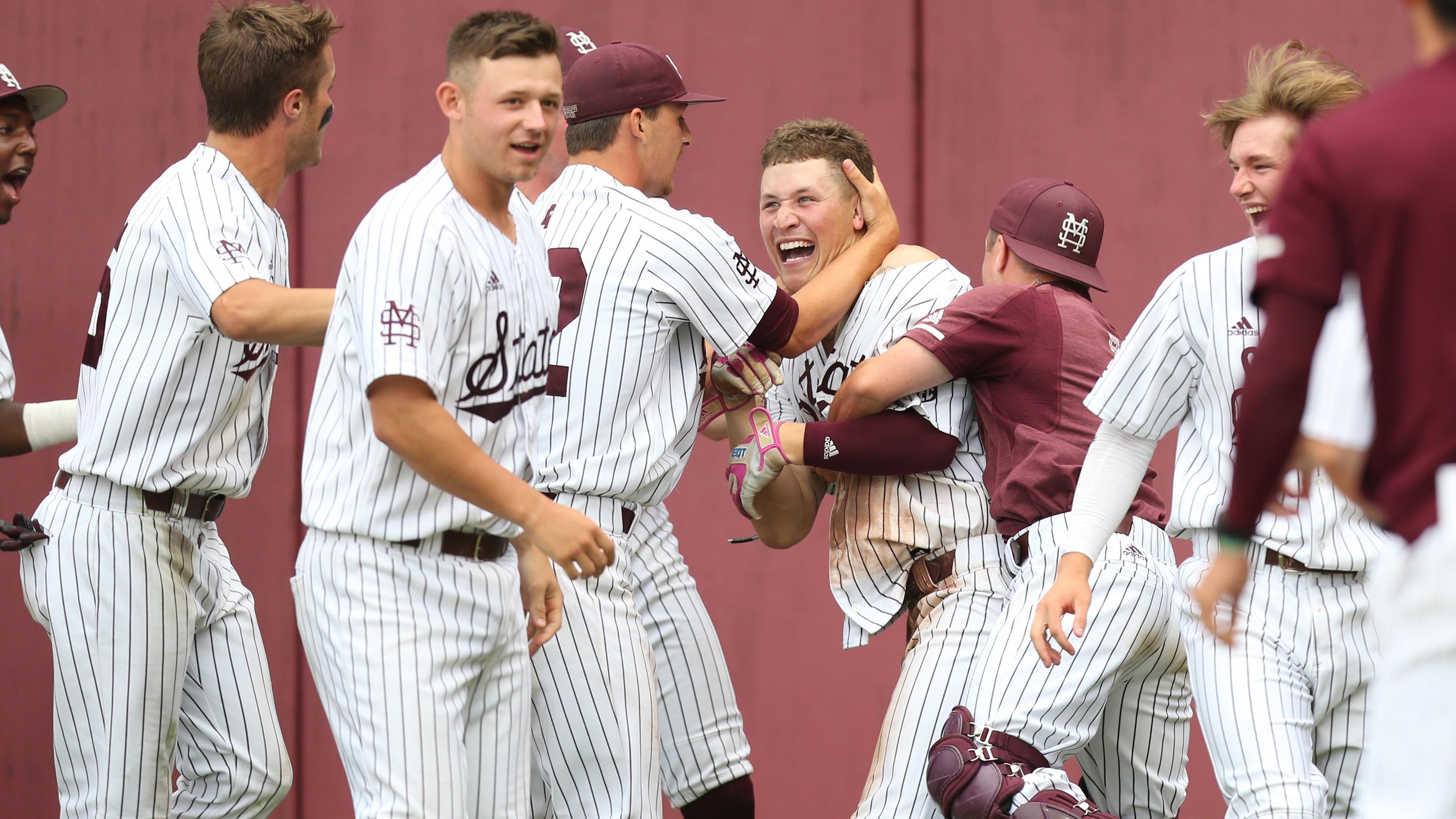 Elijah MacNamee celebrates with Mississippi State teammates after his walk-off home run against Florida State